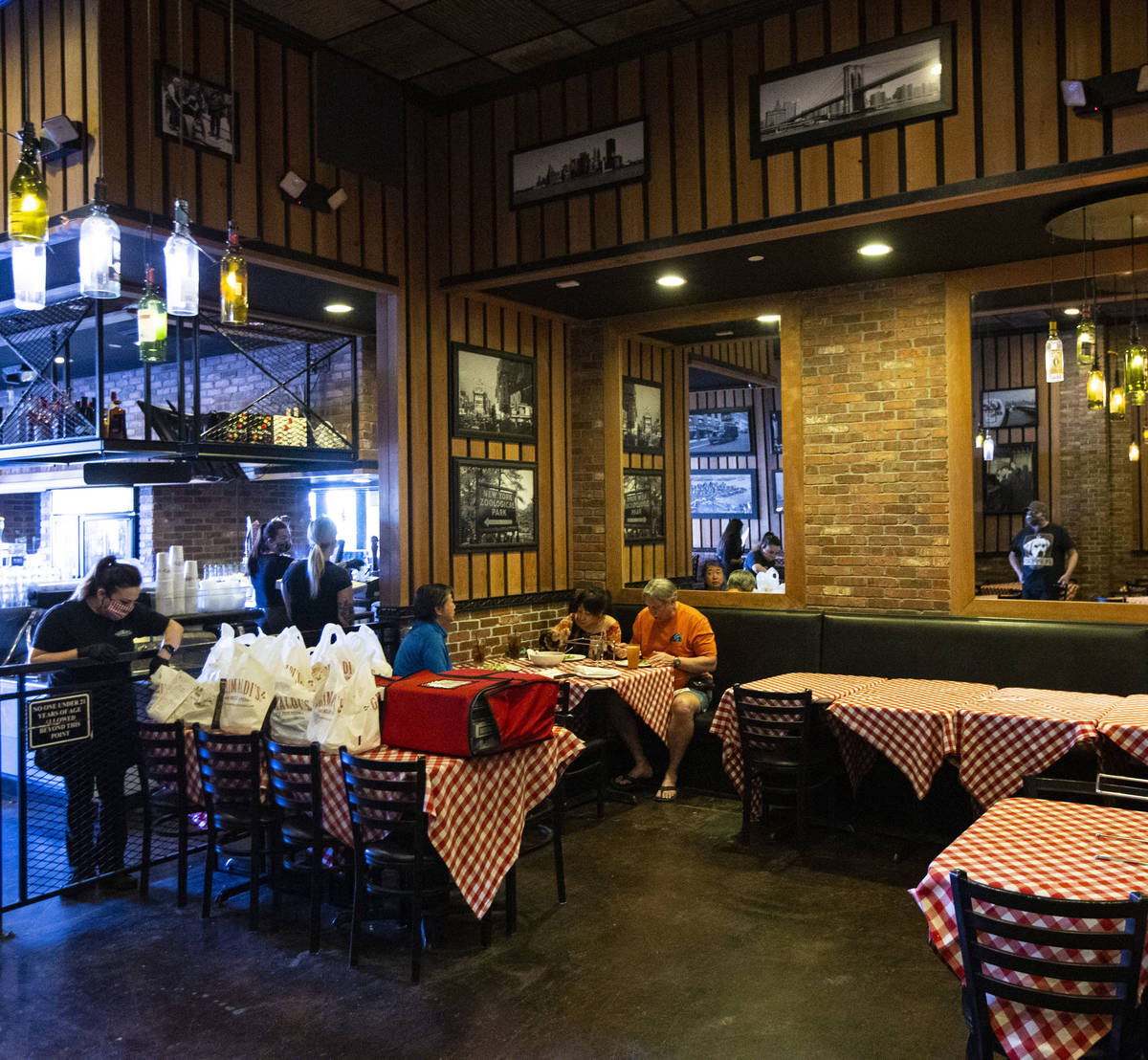 People dine at Grimaldi’s in Boca Park as some restaurants open for