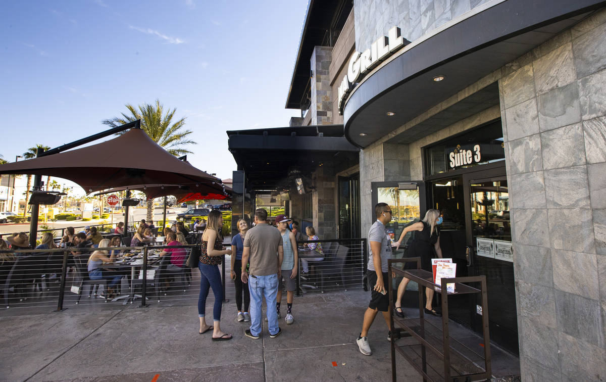 People wait for a table at Kona Grill in Boca Park as some restaurants open for table-service i ...