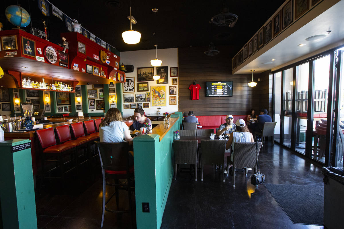 People dine at Hussong’s Cantina in Boca Park as some restaurants open