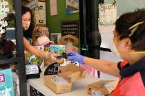 Gigi Garcia, left, helps customer Narineh Ab at "it takes a village kids" during the ...