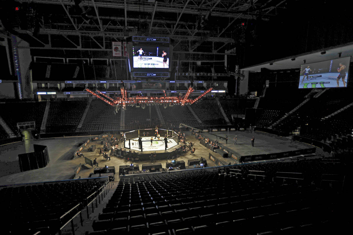Fighters battle without spectators during a UFC 249 mixed martial arts bout, Saturday, May 9, 2 ...