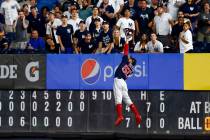 In this Sunday, Aug. 4, 2019, file photo, Boston Red Sox right fielder Mookie Betts makes a lea ...