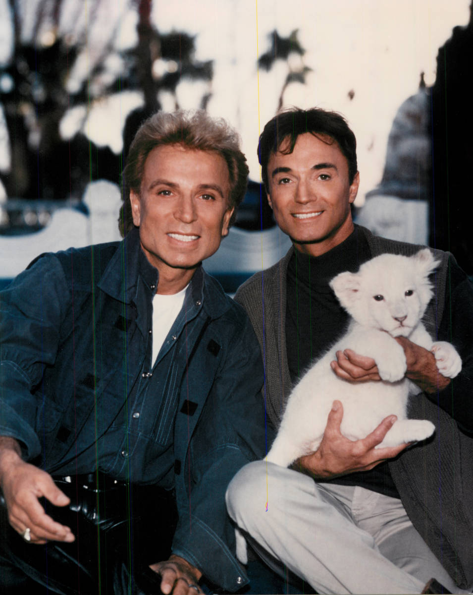 Siegfried and Roy with a tiger cub. (Review-Journal file)