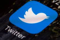 FILE - This April 26, 2017, file photo shows the Twitter app icon on a mobile phone in Philadel ...