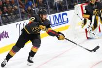 Golden Knights' Shea Theodore (27) moves the puck against the Los Angeles Kings during the seco ...