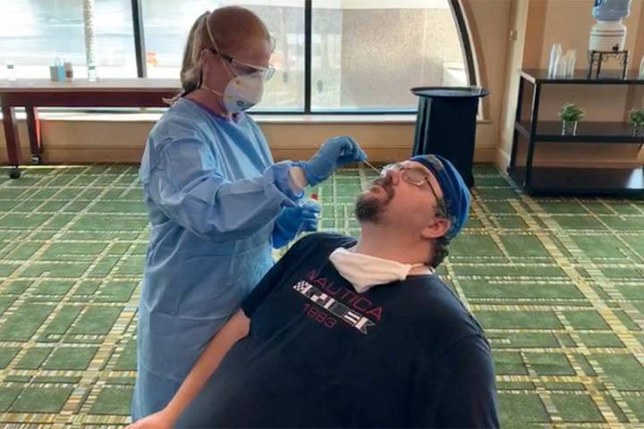 Review-Journal MMA reporter Adam Hill prepares to be tested for the coronavirus at the downtown ...