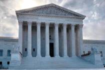 The rising sun shines over the Supreme Court building on Capitol Hill in Washington, Monday mor ...