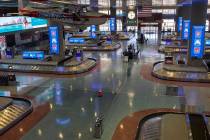 The baggage claim area in Terminal 1 is empty at McCarran International Airport on Wednesday, A ...