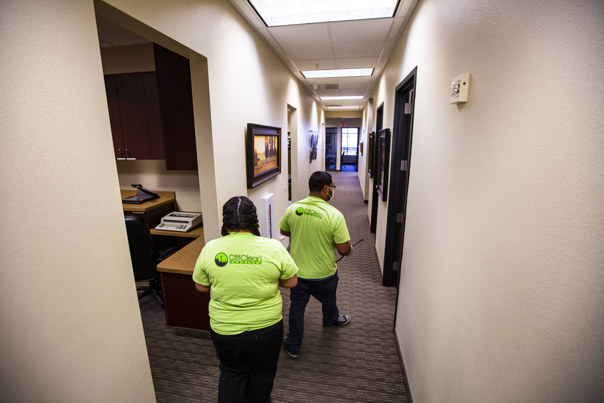 Mayola Lopez left, and Anuar Flores both of CitiClean Services, prepare to clean the lobby at t ...
