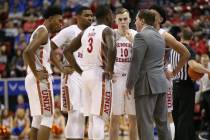 UNLV Rebels head coach T. J. Otzelberger talks to his team during a time out in the second half ...
