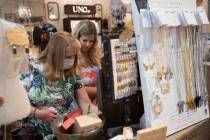 Debbie Foord, left, and her daughter Anna Corcoran shop at Magnolia Lane at The District at Gre ...