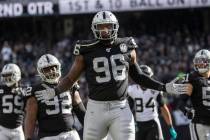 Oakland Raiders defensive end Clelin Ferrell (96) celebrates after making a defensive stop with ...