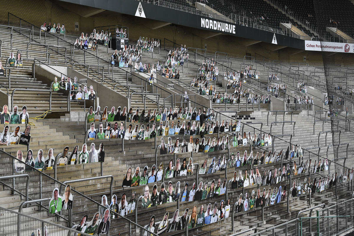 In this Thursday, April 16, 2020 file photo, portraits of fans of German Bundesliga soccer club ...