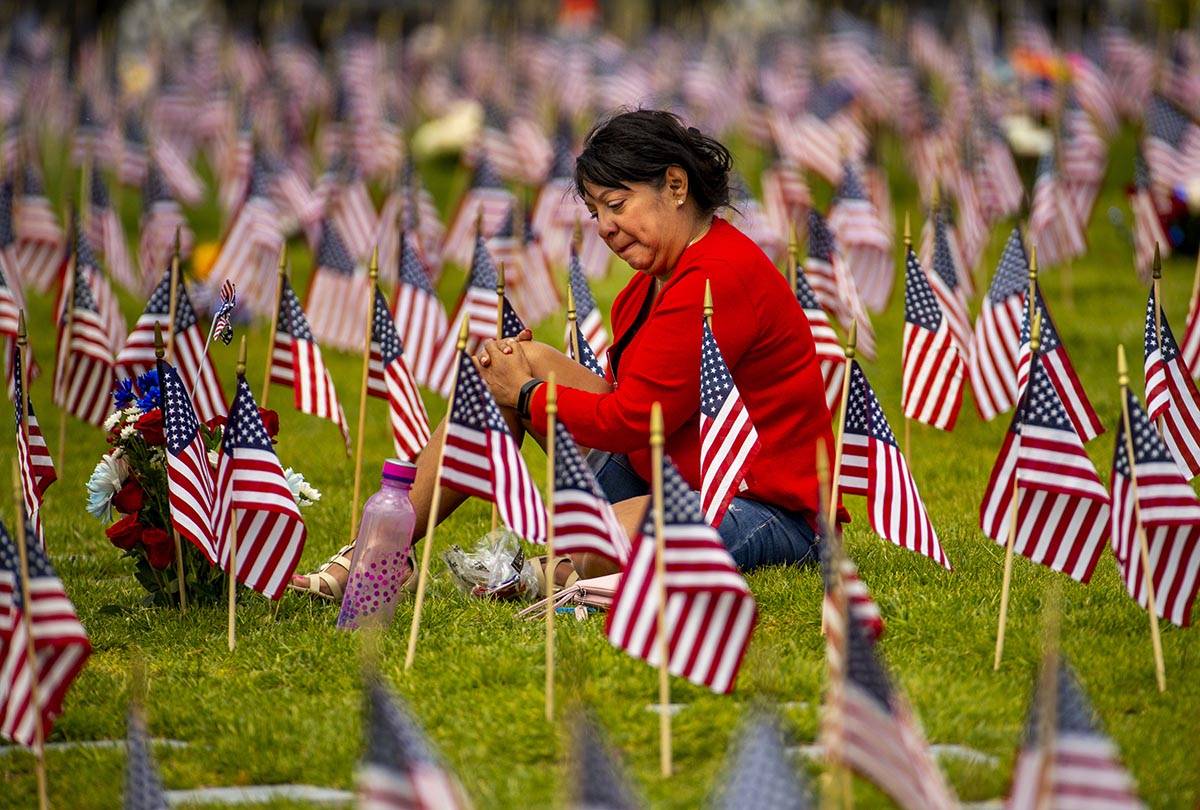 Vera Tourigny weeps while visiting her husband Raymond at the Southern Nevada Veterans Memorial ...