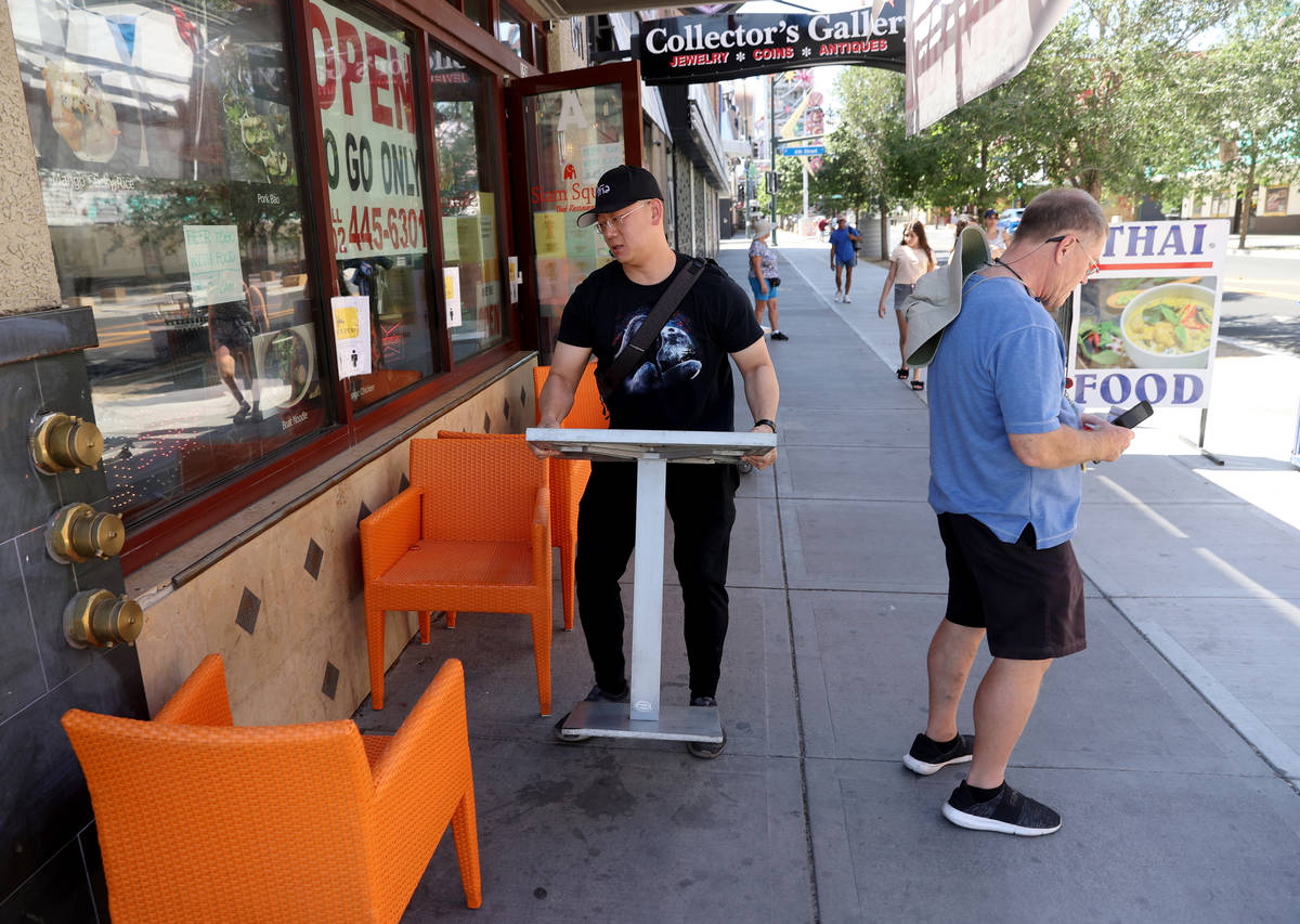 Krairit Krairavee, owner of Siam Square on East Fremont Street in downtown Las Vegas, moves tab ...