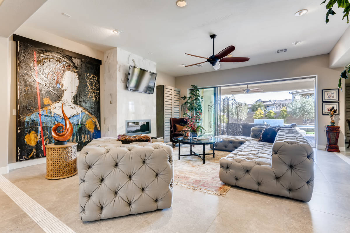 The living room features lots of art space. (Realty One Group)