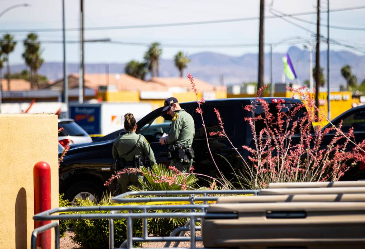 Las Vegas police investigate the scene of a shooting at Tropicana Avenue and Maryland Parkway i ...