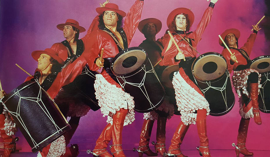 Luis A. Frias, third from left, leads the Los Gauchos Latinos dance troupe, performing with the ...