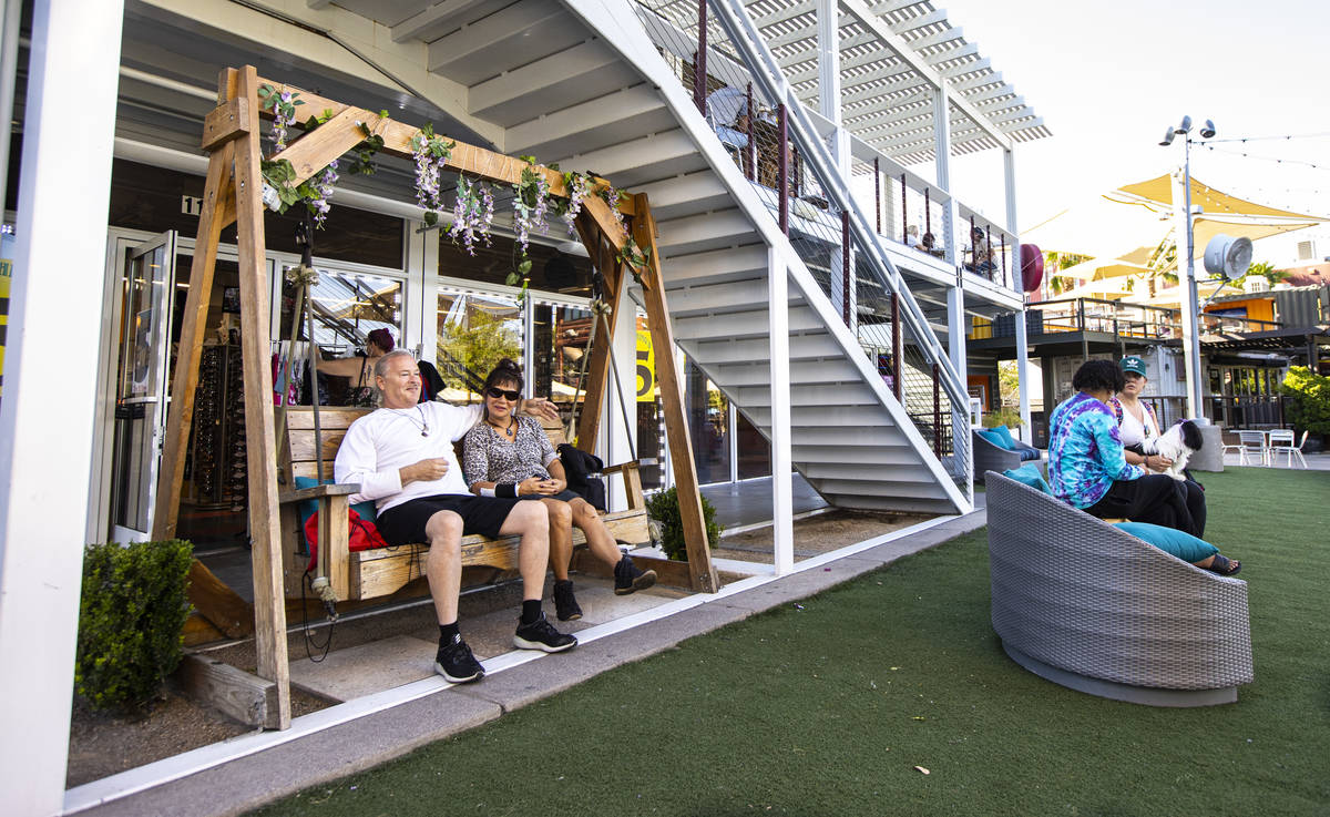 Greg Dryan, left, visiting from San Francisco, relaxes with Yong Cho, of Las Vegas, at the Down ...