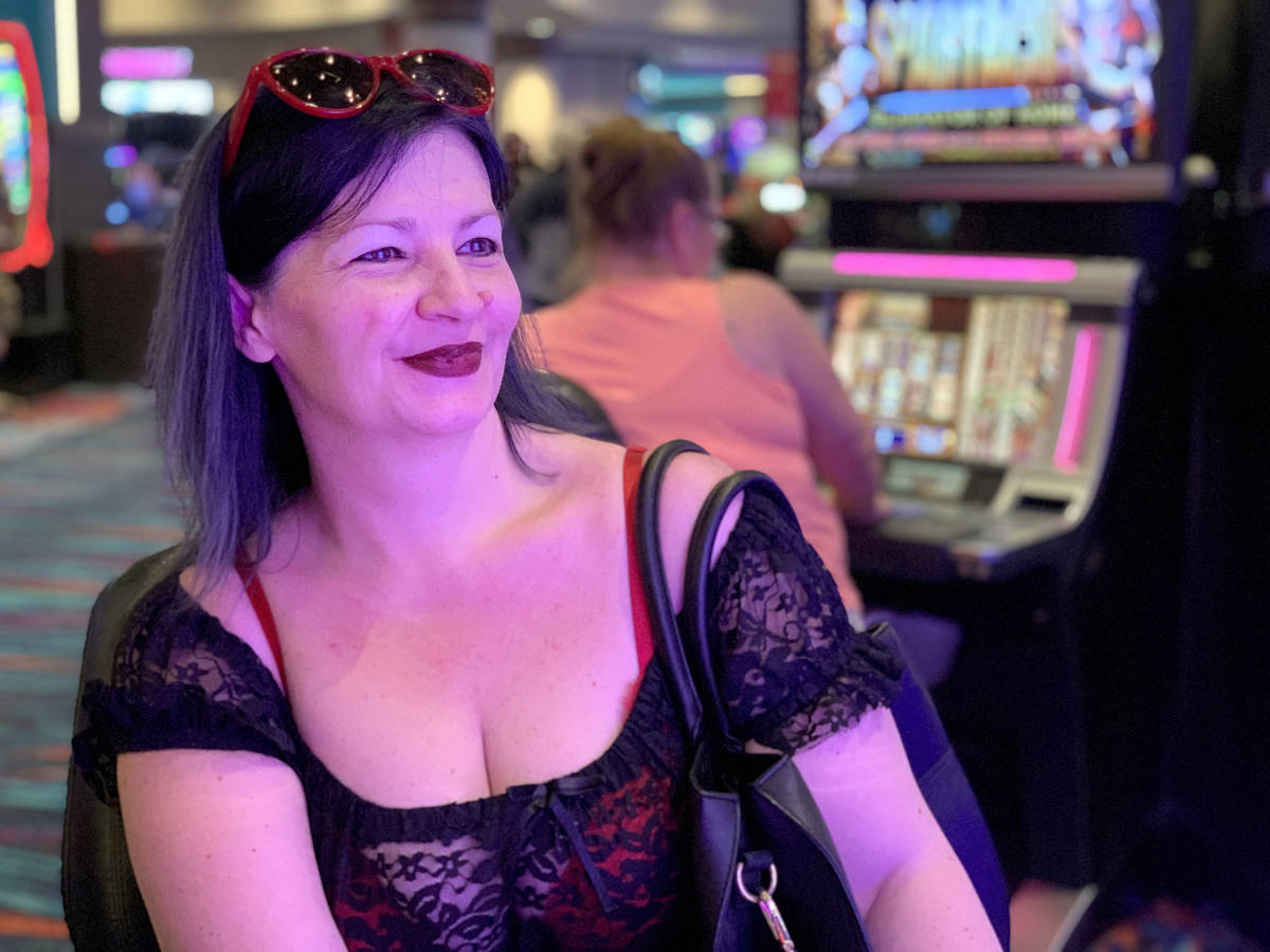 Mihaela Steyer of Las Vegas plays a slot machine on her 47th birthday during the reopening of H ...