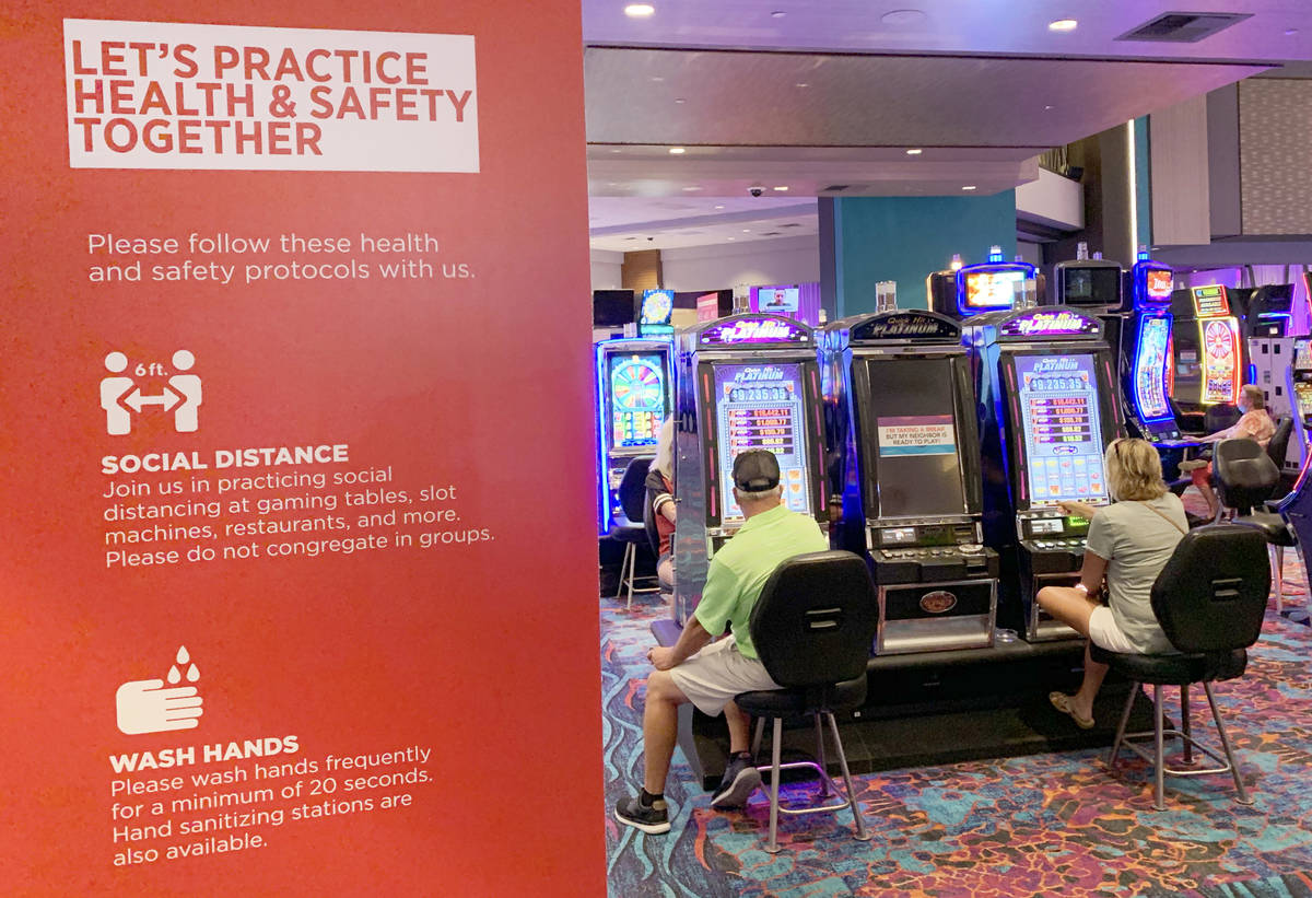 Social distancing reminders are seen during the reopening of Harrah's Ak-Chin Casino in Maricop ...