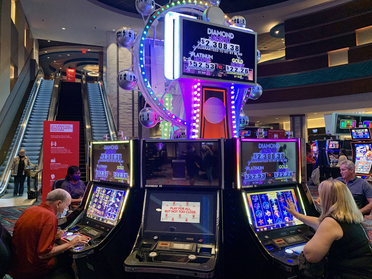 Individuals play games while following social distancing that is enforced  during the reopening … | Las Vegas Review-Journal