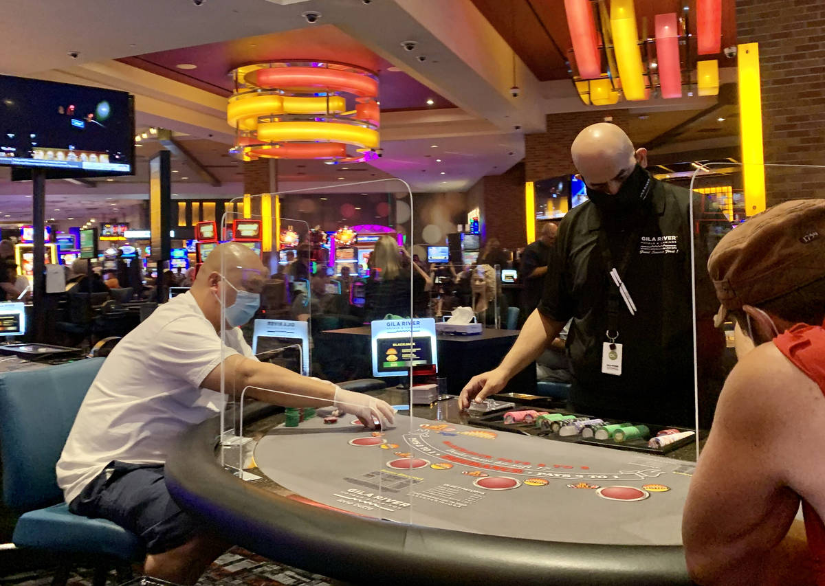 Individuals play table games at Gila River Casino's Lone Butte location on the packed reopening … | Las Vegas Review-Journal