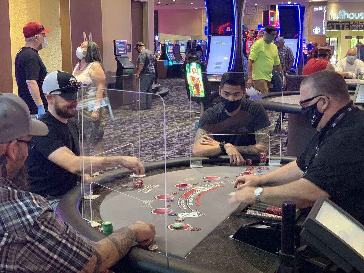 Individuals play table games at Gila River Casino's Lone Butte location on the packed reopening … | Las Vegas Review-Journal