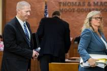 Henderson police officer Jared Spangler, left, and attorney Lisa Anderson leave the Thomas & Ma ...