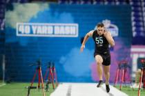 Clemson defensive back Tanner Muse runs the 40-yard dash at the NFL football scouting combine i ...