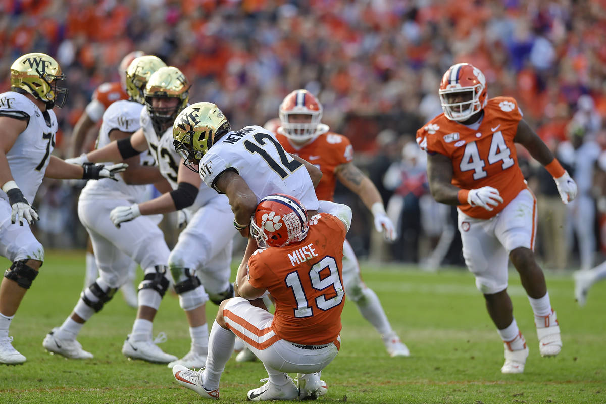 Clemson's Tanner Muse (19) sacks Wake Forest quarterback Jamie Newman during the first half of ...