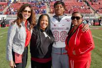 UNLV's Ty'Jason Roberts stands on the field with, from left, UNLV athletic director Desiree Ree ...