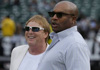 Former Los Angeles Raiders running back Bo Jackson, right, watches with Oakland Raiders owner M ...