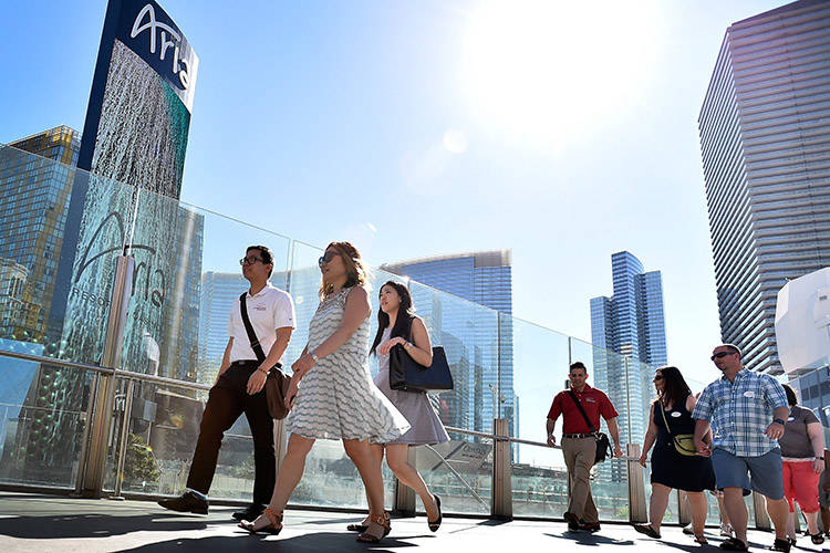 Tour guide Hamilton Tran, left, leads guests during a Lip Smacking Foodie Tour Tuesday, July 5, ...