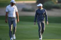 FILE - In this Jan. 18, 2018, file photo, Dustin Johnson of the United States, left, and Rory M ...