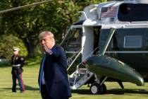 President Donald Trump points as the walks on the South Lawn as he departs the White House on M ...