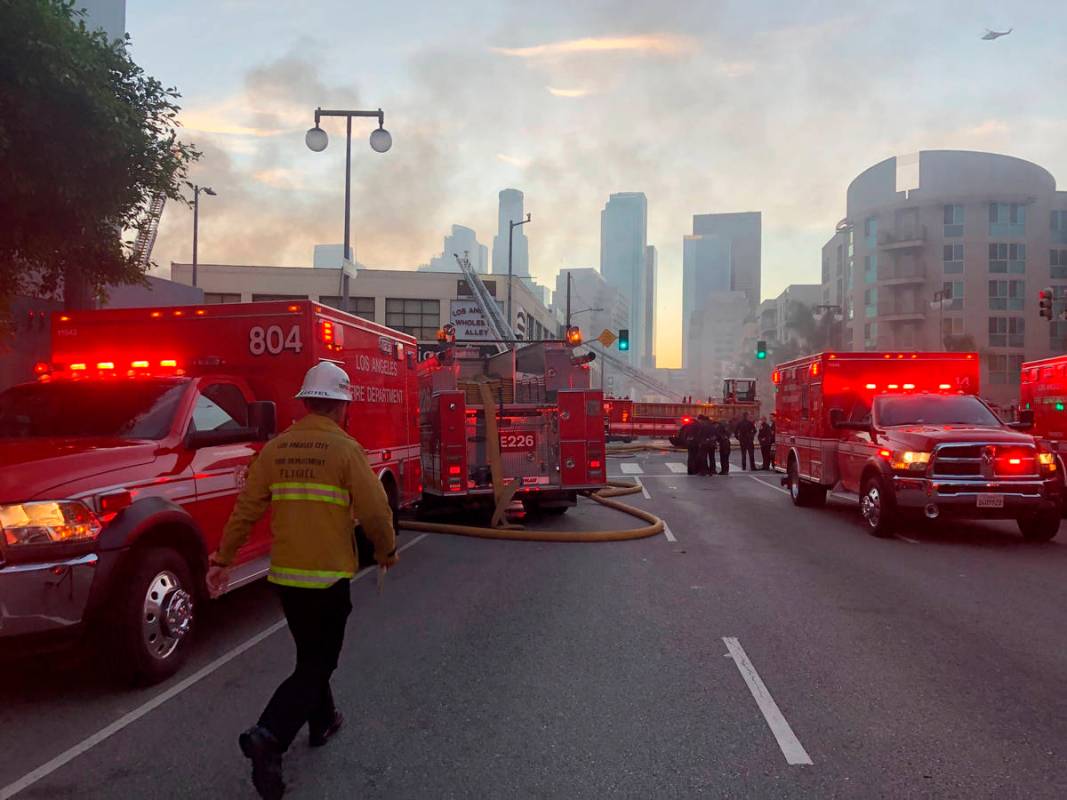 Firefighters respond to an explosion in downtown Los Angeles that has injured multiple firefigh ...