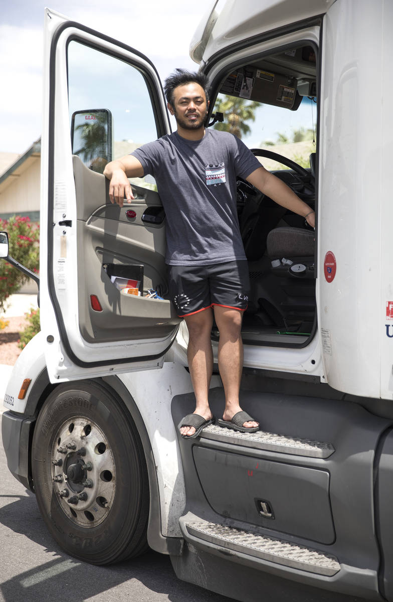 Kim Santiago, an over-the-road truck driver, outside his truck at his home in Las Vegas on Sund ...