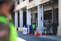 The Nevada National Guard waits for patients at the COVID-19 drive-through testing at the parki ...