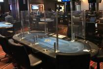 Poker tables with plexiglass dividers are being used at the Seminole Hard Rock casino in Tampa, ...