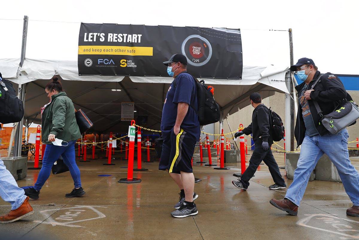 United Auto Workers members leave the Fiat Chrysler Automobiles Warren Truck Plant after the fi ...