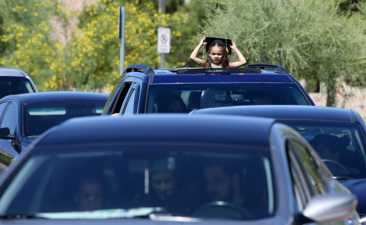 Avery Warren, 4, drive-thru graduation for preschoolers at SkyView YMCA in Las Vegas Tuesday, M ...