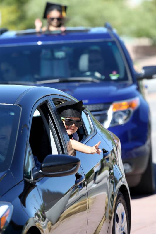 Julian Acosta and Avery Warren, both 4, during drive-thru graduation for preschoolers at SkyVie ...