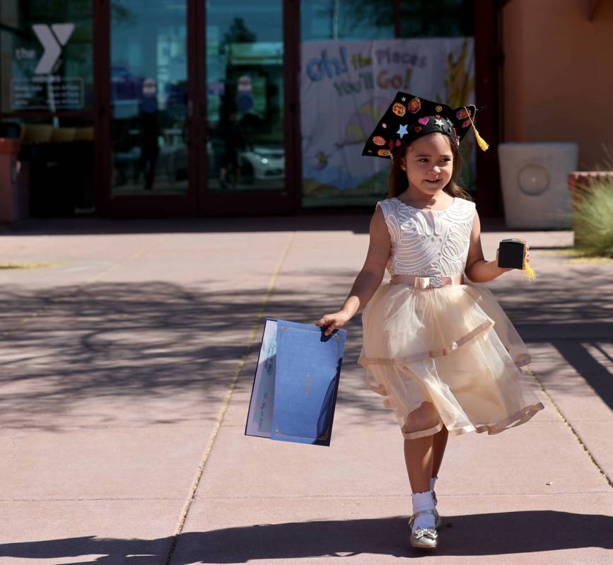 J'Lysia Topscher, 5, during drive-thru graduation for preschoolers at SkyView YMCA in Las Vegas ...