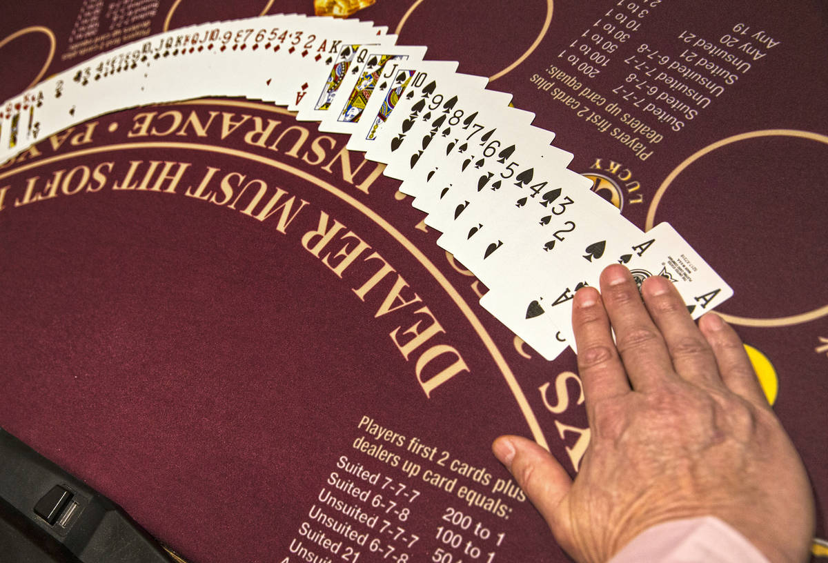 A dealer displays cards at MGM Grand hotel-casino in Las Vegas on Thursday, April 19, 2018. (Be ...