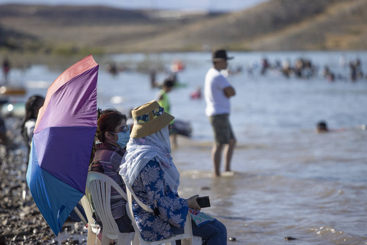Few wore masks at Boulder Beach at Lake Mead National Recreation Area on Memorial Day on Monday ...