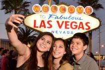 Chiara Atienza, from Quad Cities, Iowa, left, poses with her siblings, Catia, center, and Caide ...