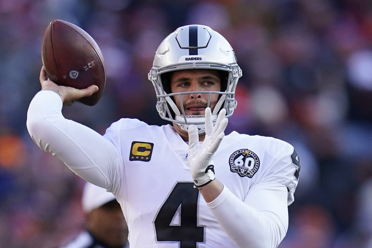 Oakland Raiders quarterback Derek Carr throws a pass during the first half of an NFL football g ...