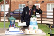 In this photo provided by Capture the Light Photography, Second World War veteran Captain Tom ...