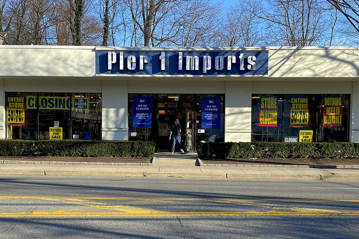 A customer steps out of a Pier 1 Imports store which was having a closeout sale, Monday, Feb. 1 ...